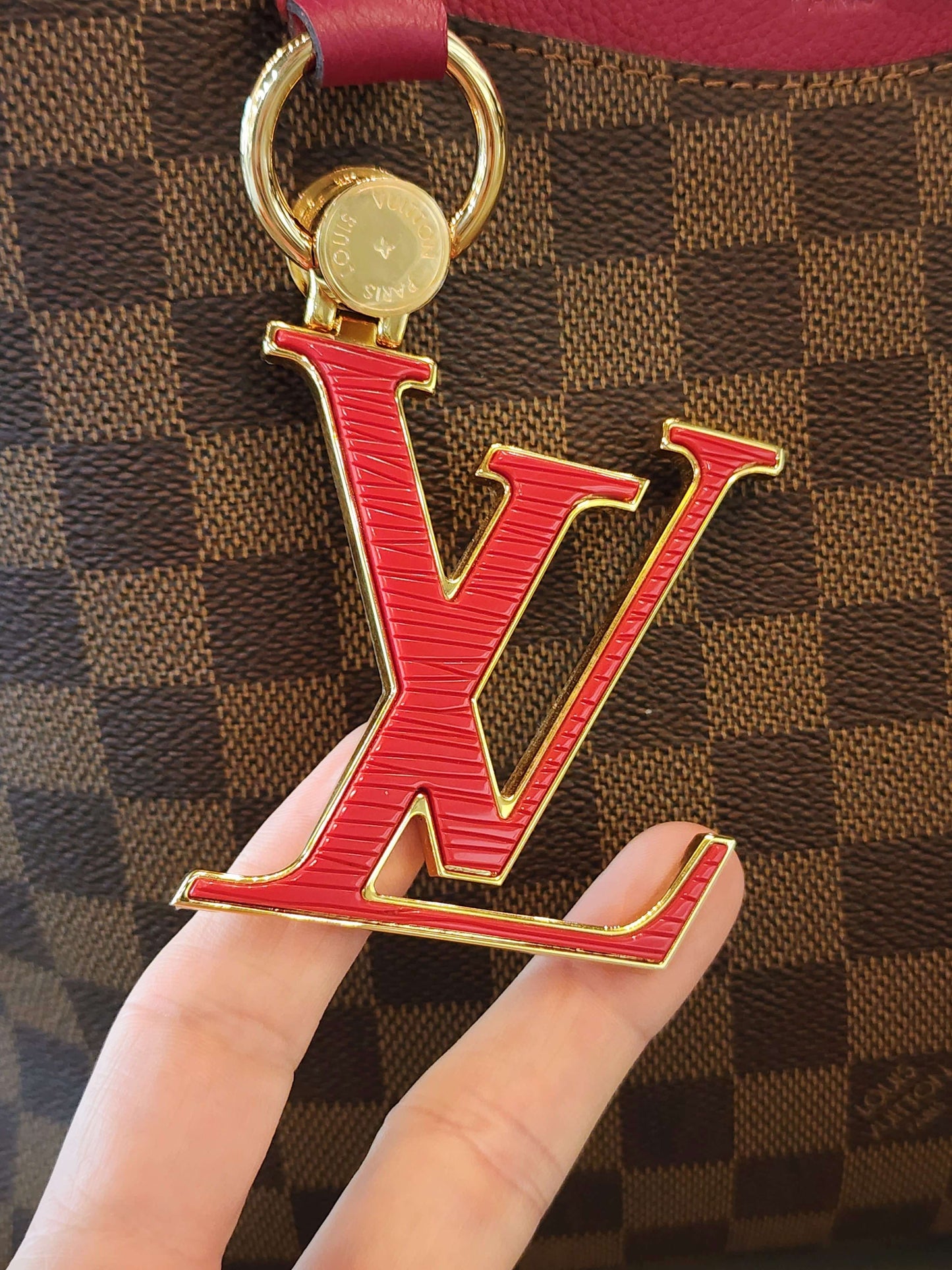 LOUIS VUITTON
Damier Ebene LV Riverside Lie De Vin Handbag
