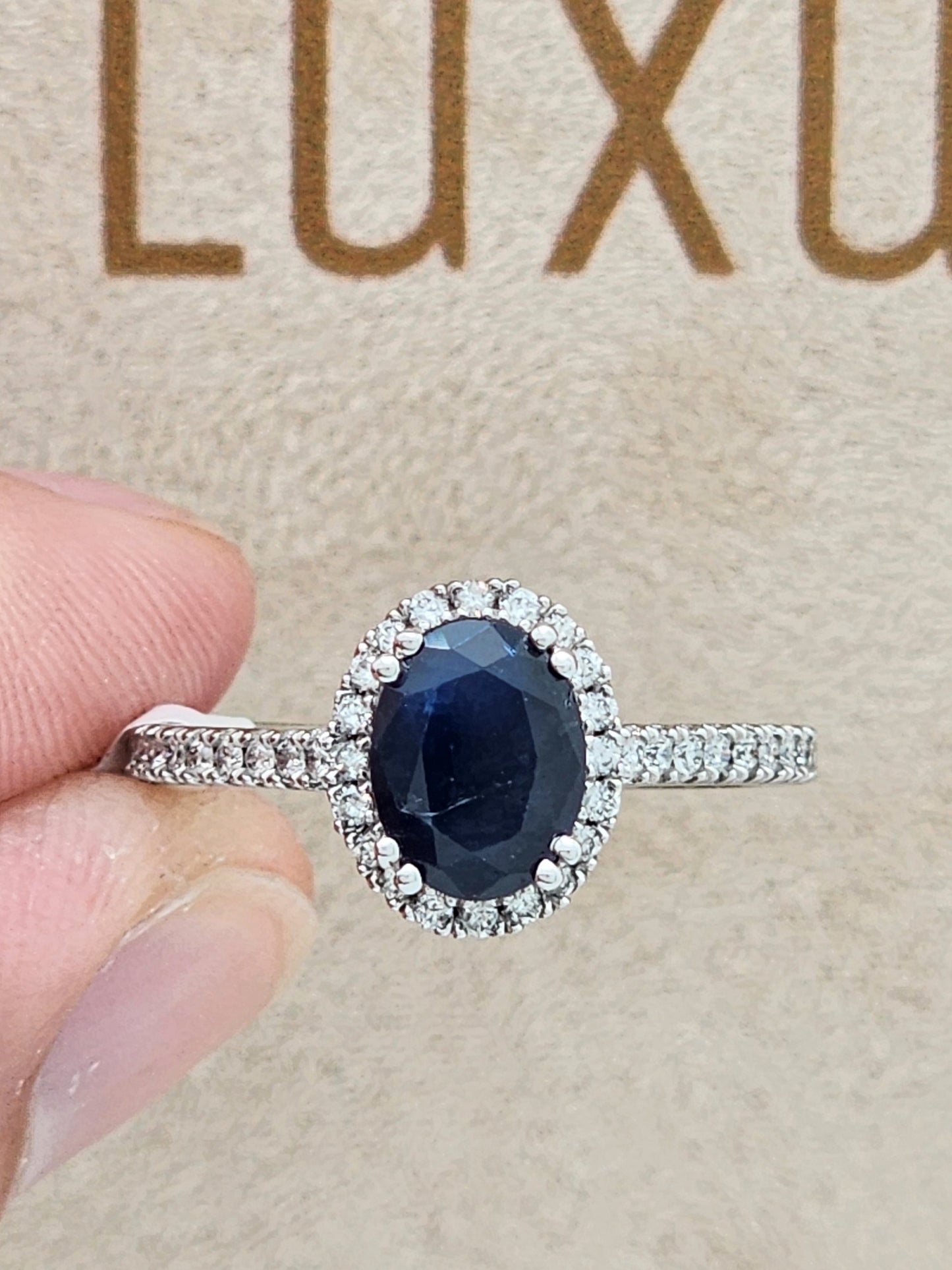 1.52 Carat Oval Blue Sapphire in 14KWG Diamond Halo Setting!