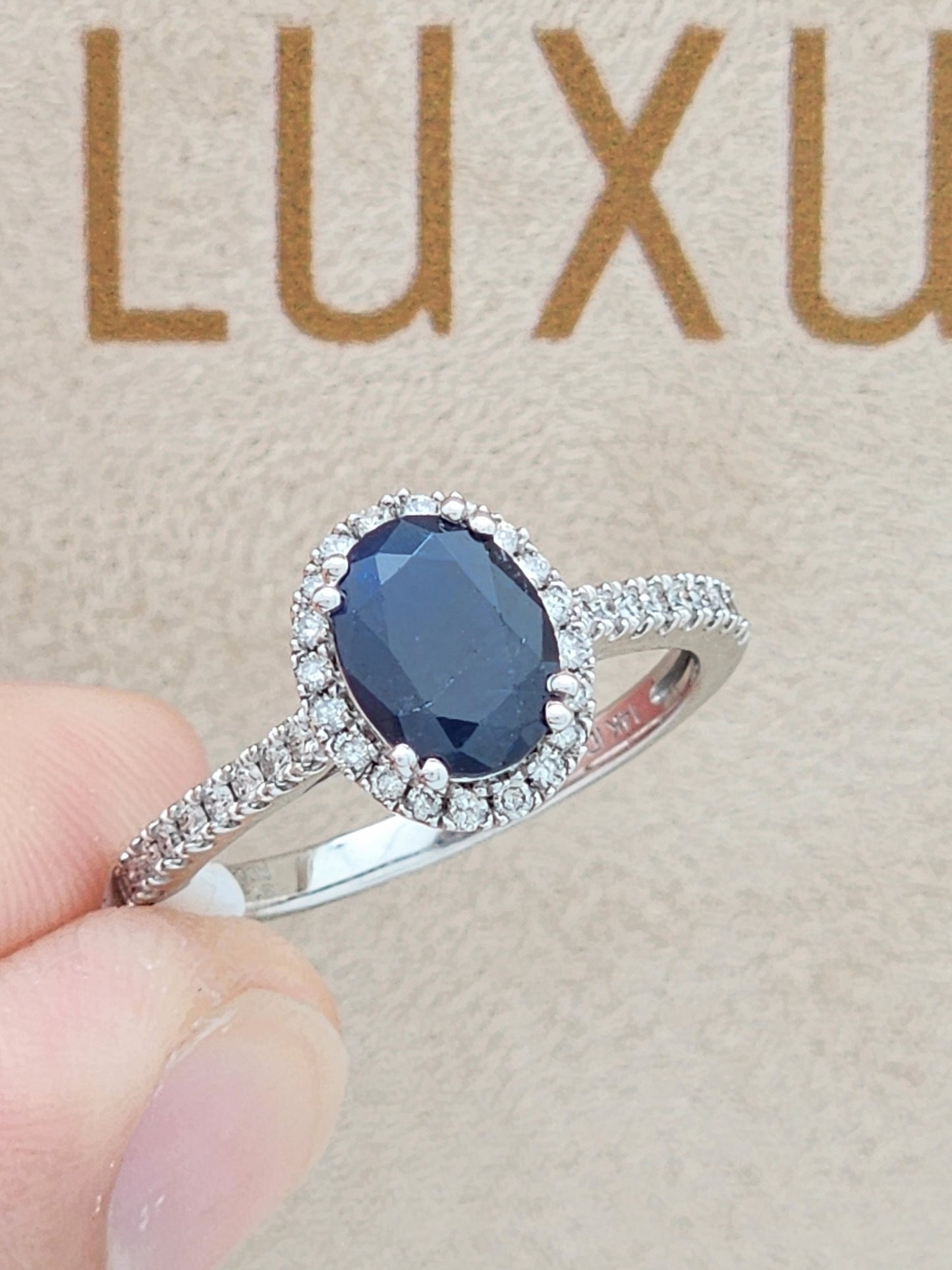 1.52 Carat Oval Blue Sapphire in 14KWG Diamond Halo Setting!