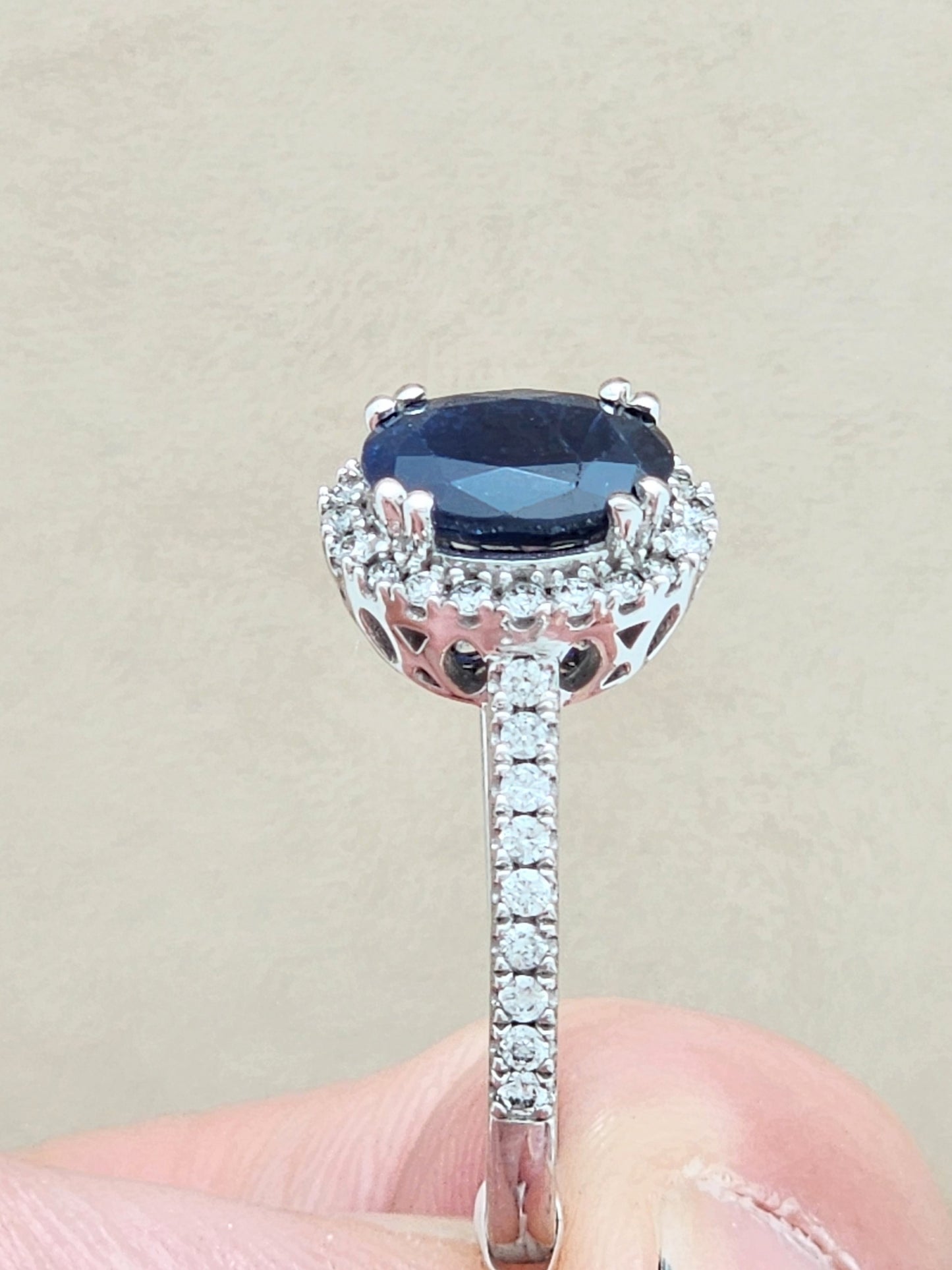 1.52 Carat Oval Blue Sapphire in 14KWG Diamond Halo Setting!