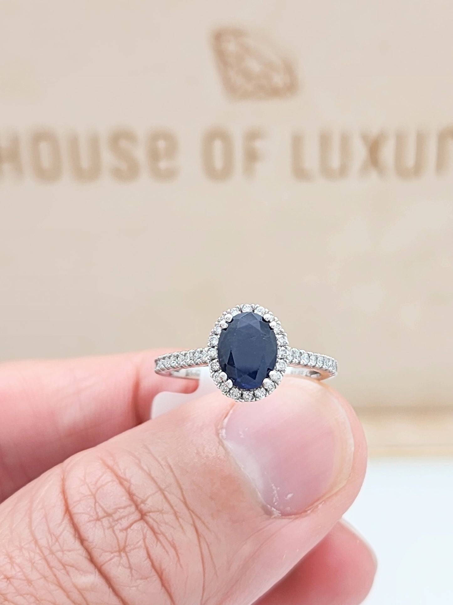 1.52 Carat Oval Blue Sapphire in 14KWG Diamond Halo Setting!