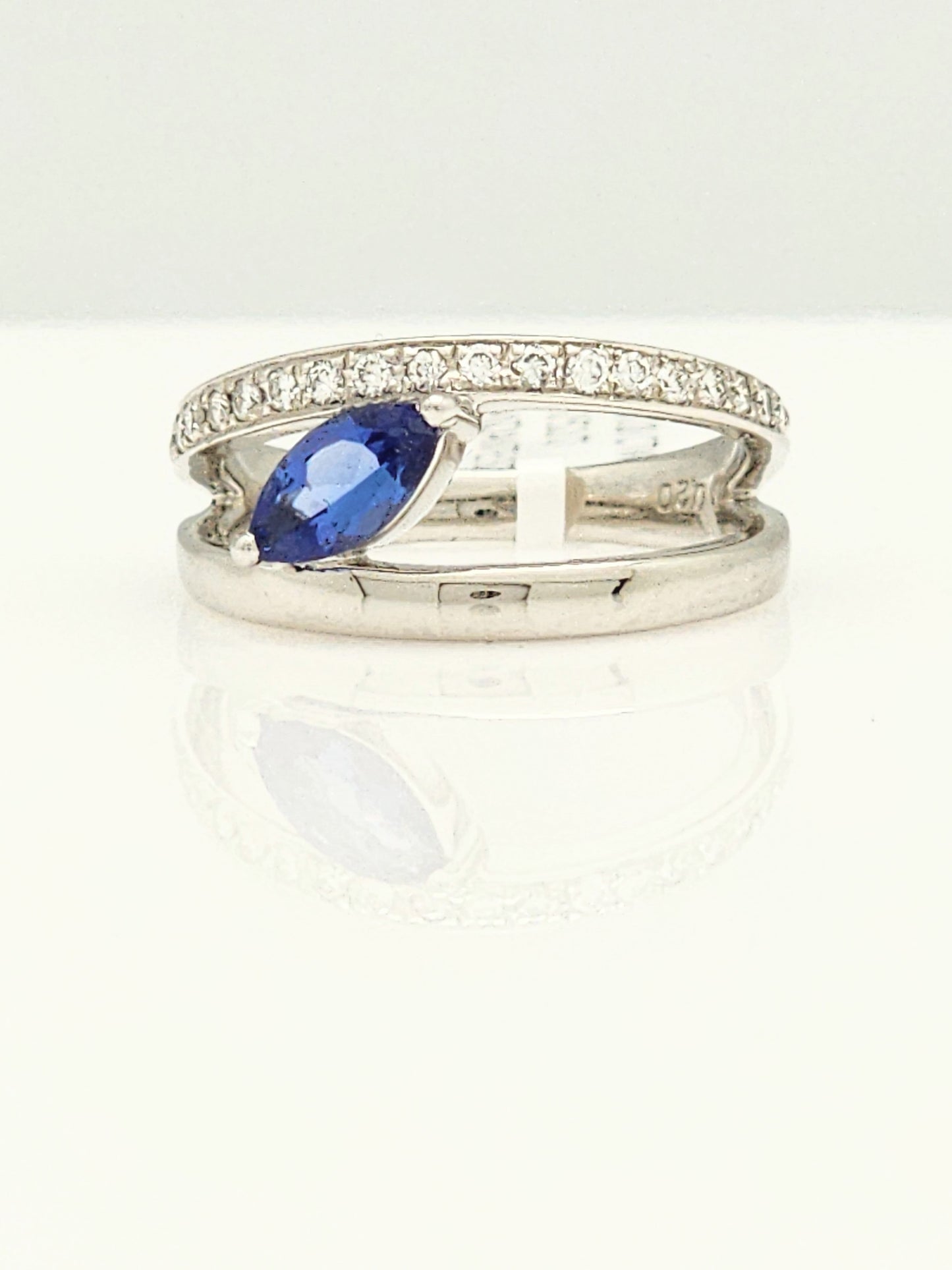 0.72 CARAT TANZANITE and DIAMOND RING in PLATINUM
