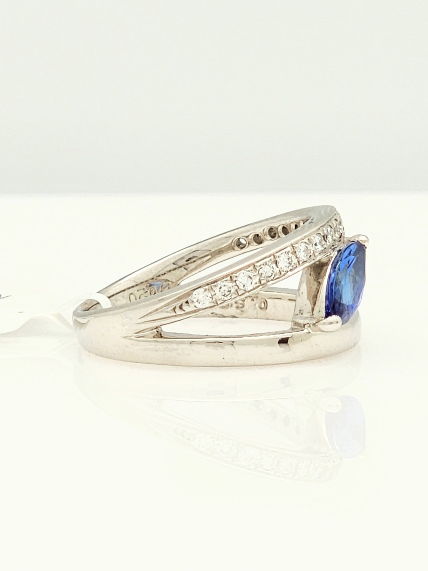 0.72 CARAT TANZANITE and DIAMOND RING in PLATINUM