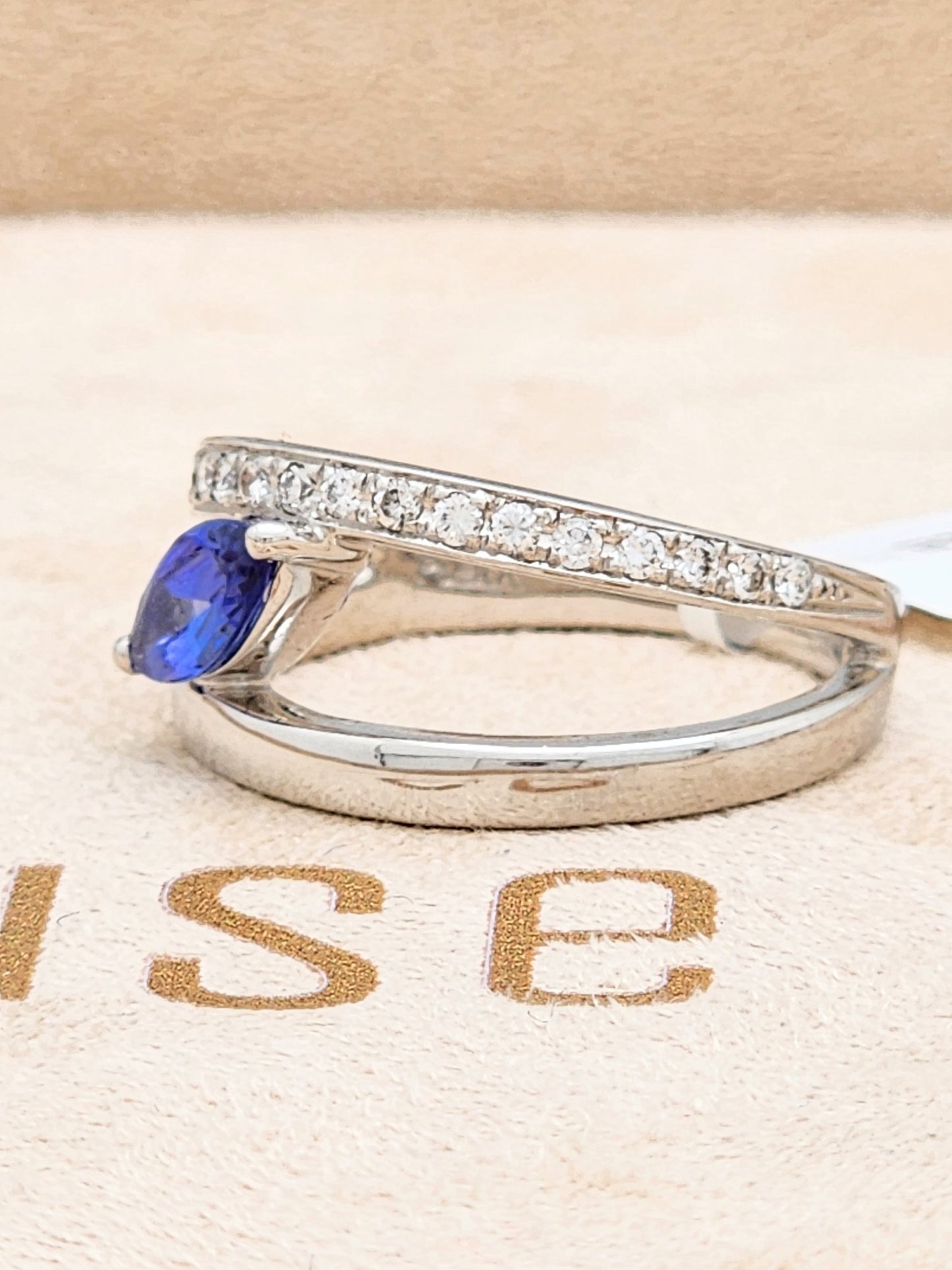 0.72 CARAT TANZANITE and DIAMOND RING in PLATINUM