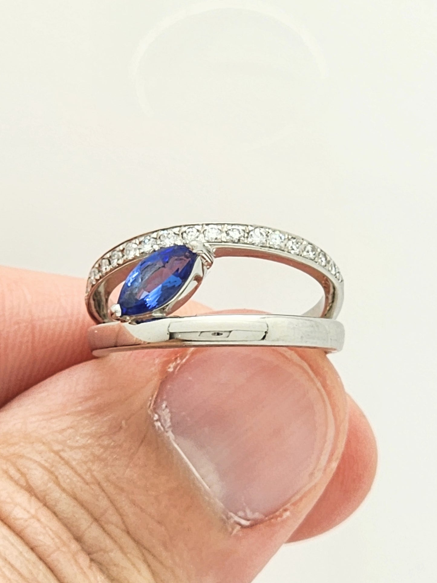 0.72 CARAT TANZANITE and DIAMOND RING in PLATINUM