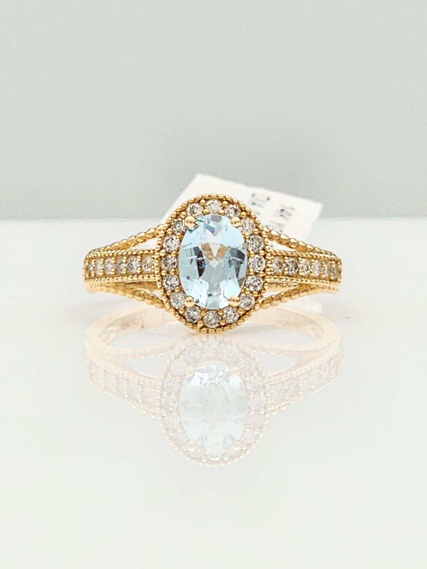 0.98 Total Carat Aquamarine and Diamond Halo Ring in 14KYG!