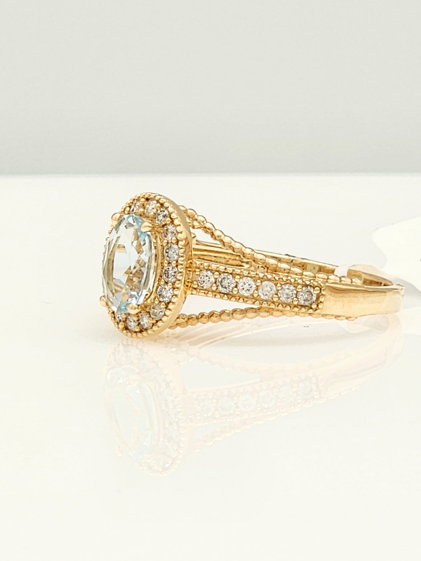 0.98 Total Carat Aquamarine and Diamond Halo Ring in 14KYG!