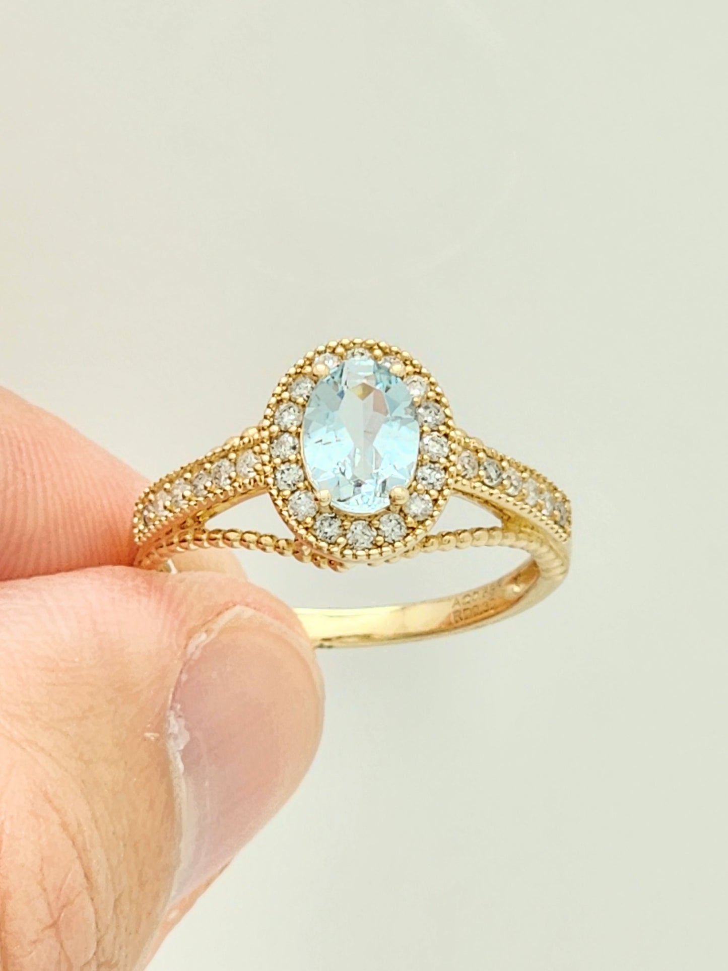 0.98 Total Carat Aquamarine and Diamond Halo Ring in 14KYG!