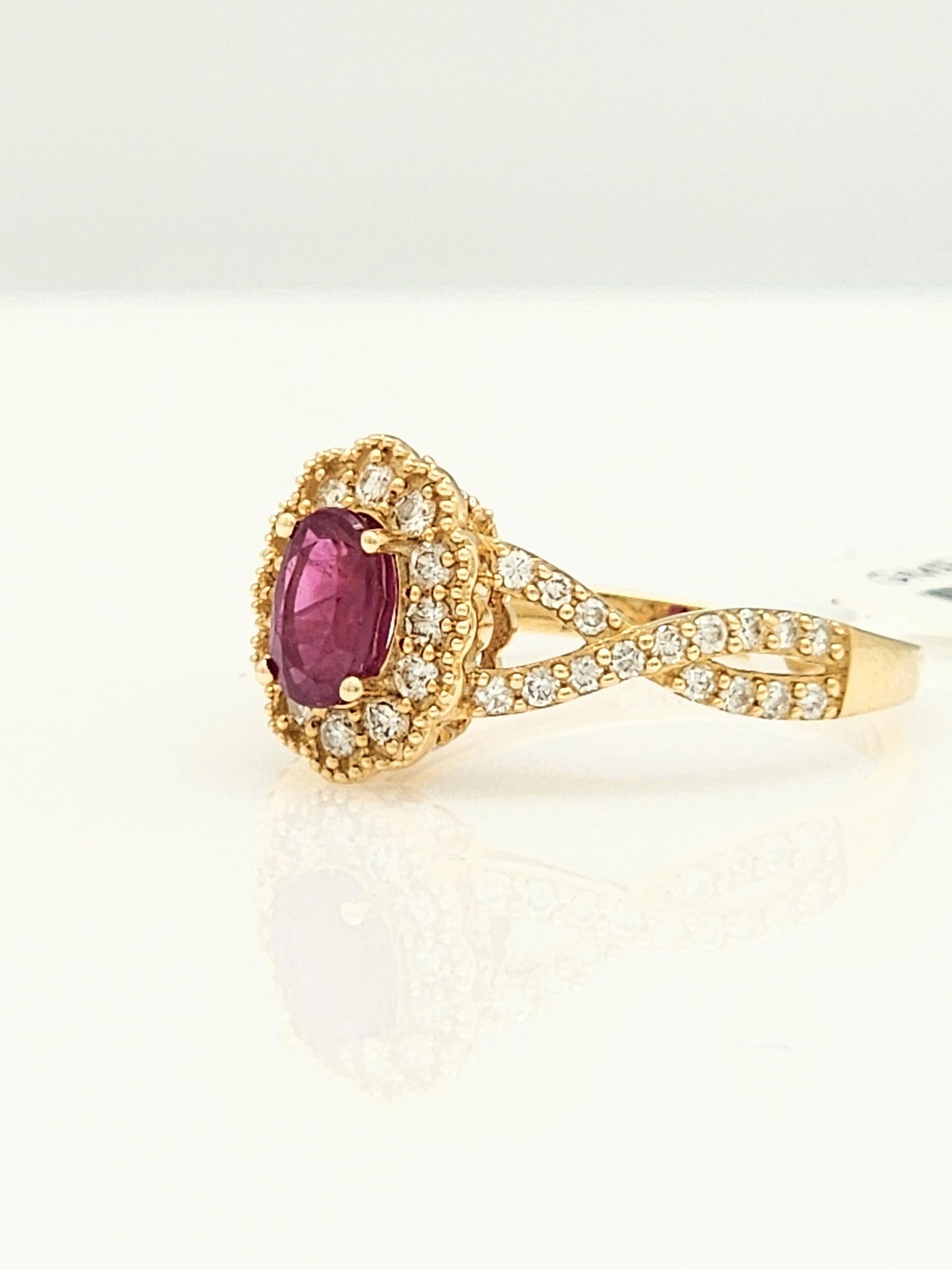 1.08 Total Carat Ruby and Diamond Halo Ring in 14KYG!
