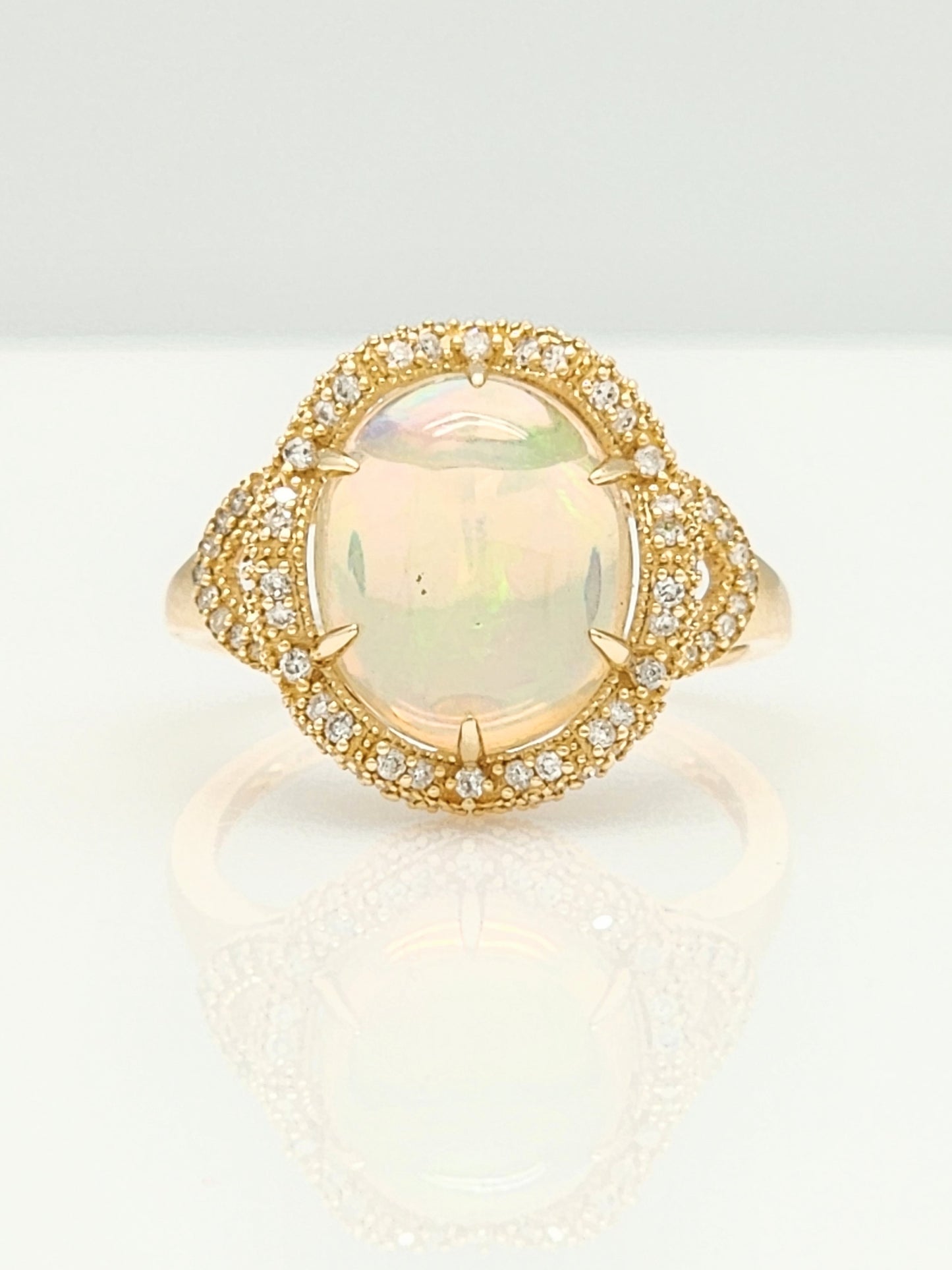 3.33 Total Carat Opal and Diamond Halo Ring in 14KYG!