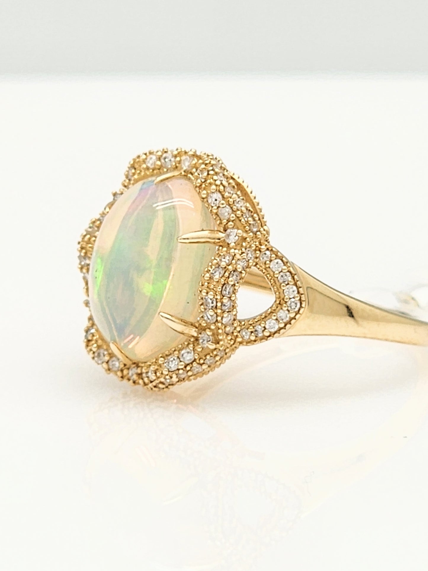 3.33 Total Carat Opal and Diamond Halo Ring in 14KYG!
