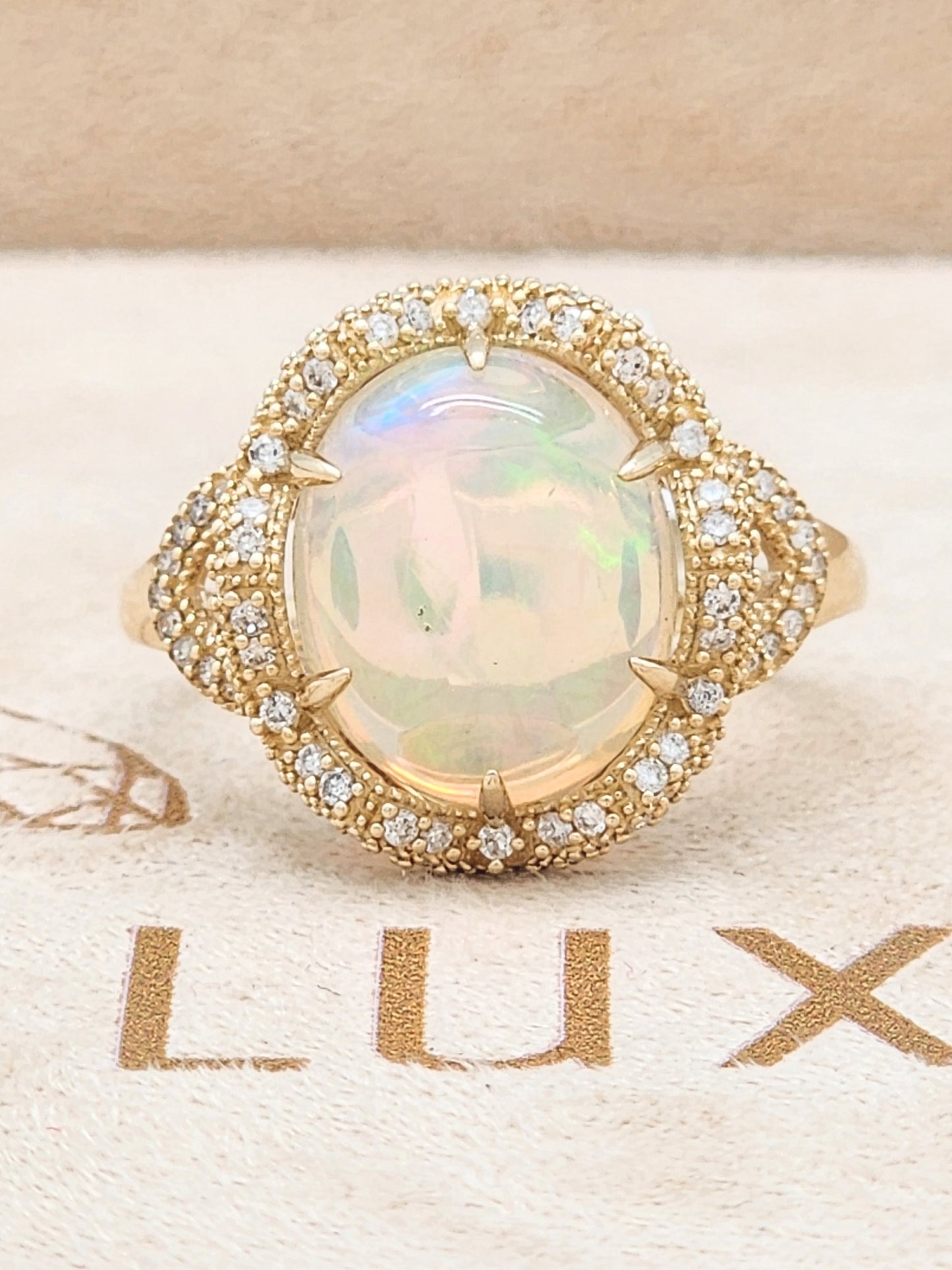 3.33 Total Carat Opal and Diamond Halo Ring in 14KYG!