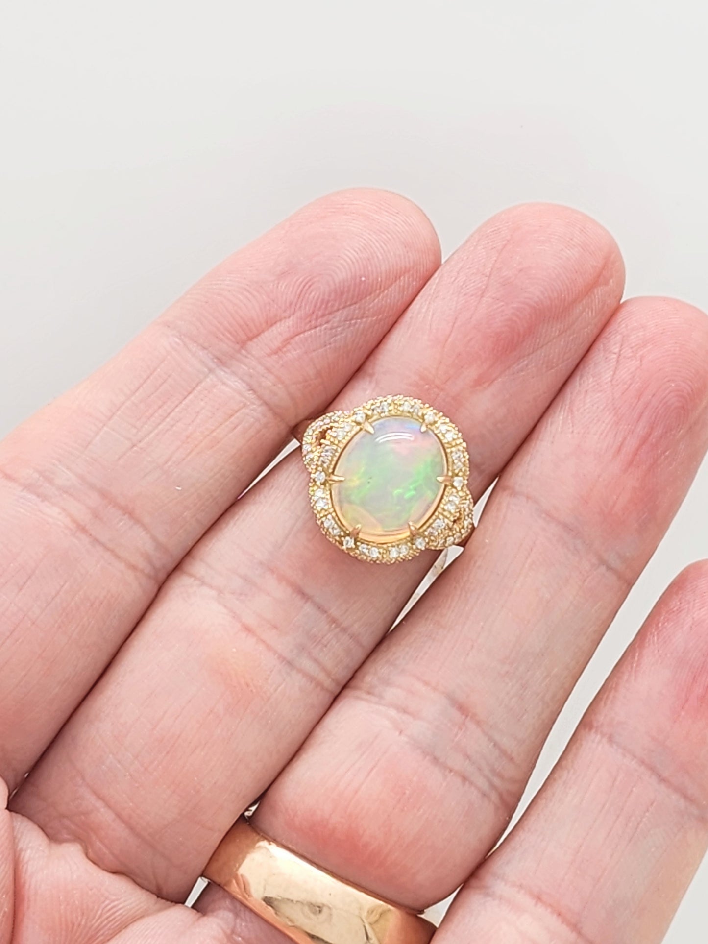 3.33 Total Carat Opal and Diamond Halo Ring in 14KYG!
