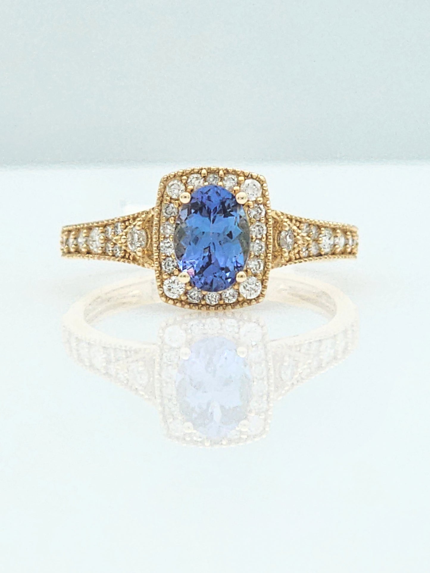 1.23 Total Carat Blue Sapphire and Diamond Halo Ring in 14KYG!