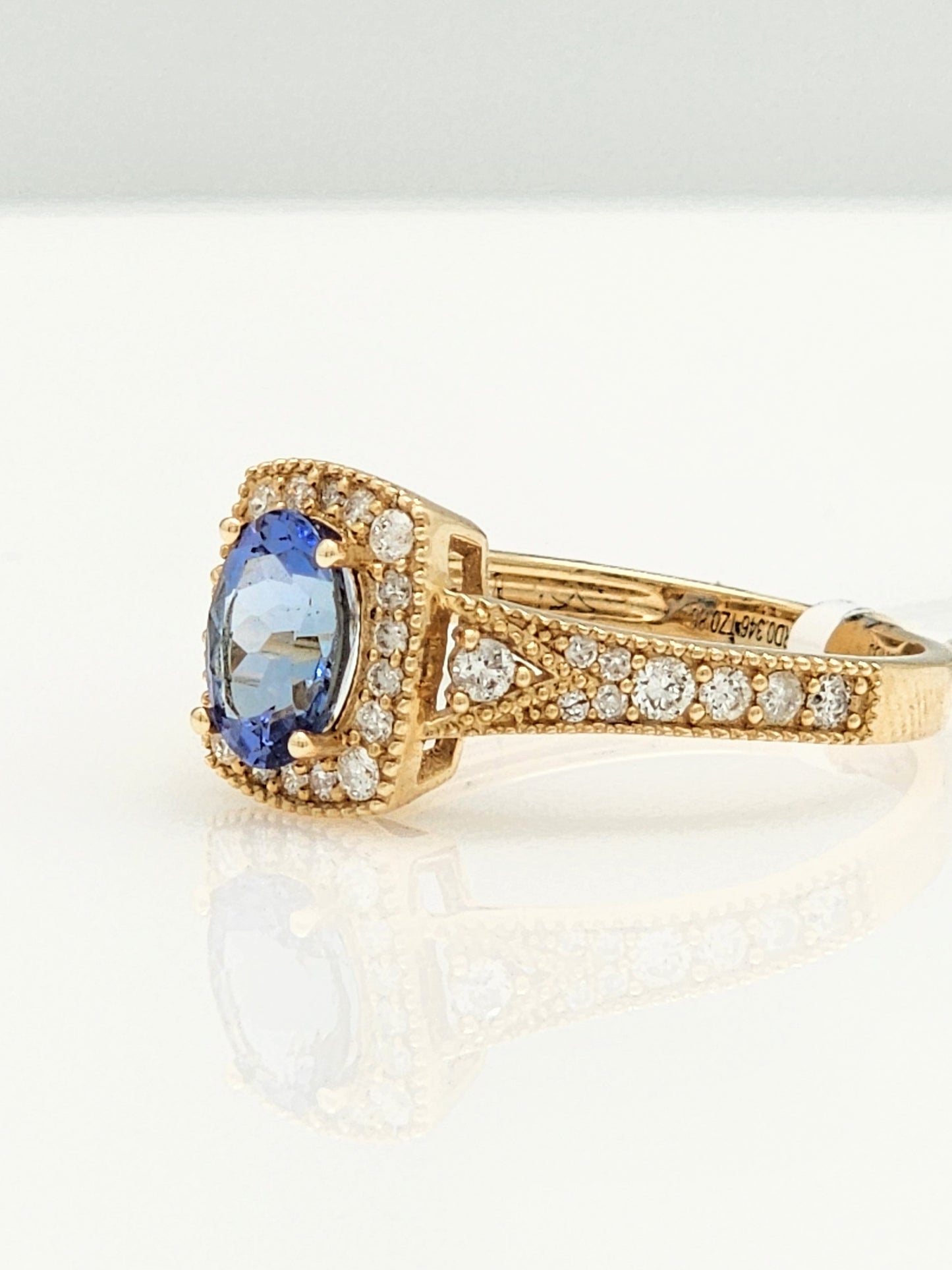 1.23 Total Carat Blue Sapphire and Diamond Halo Ring in 14KYG!