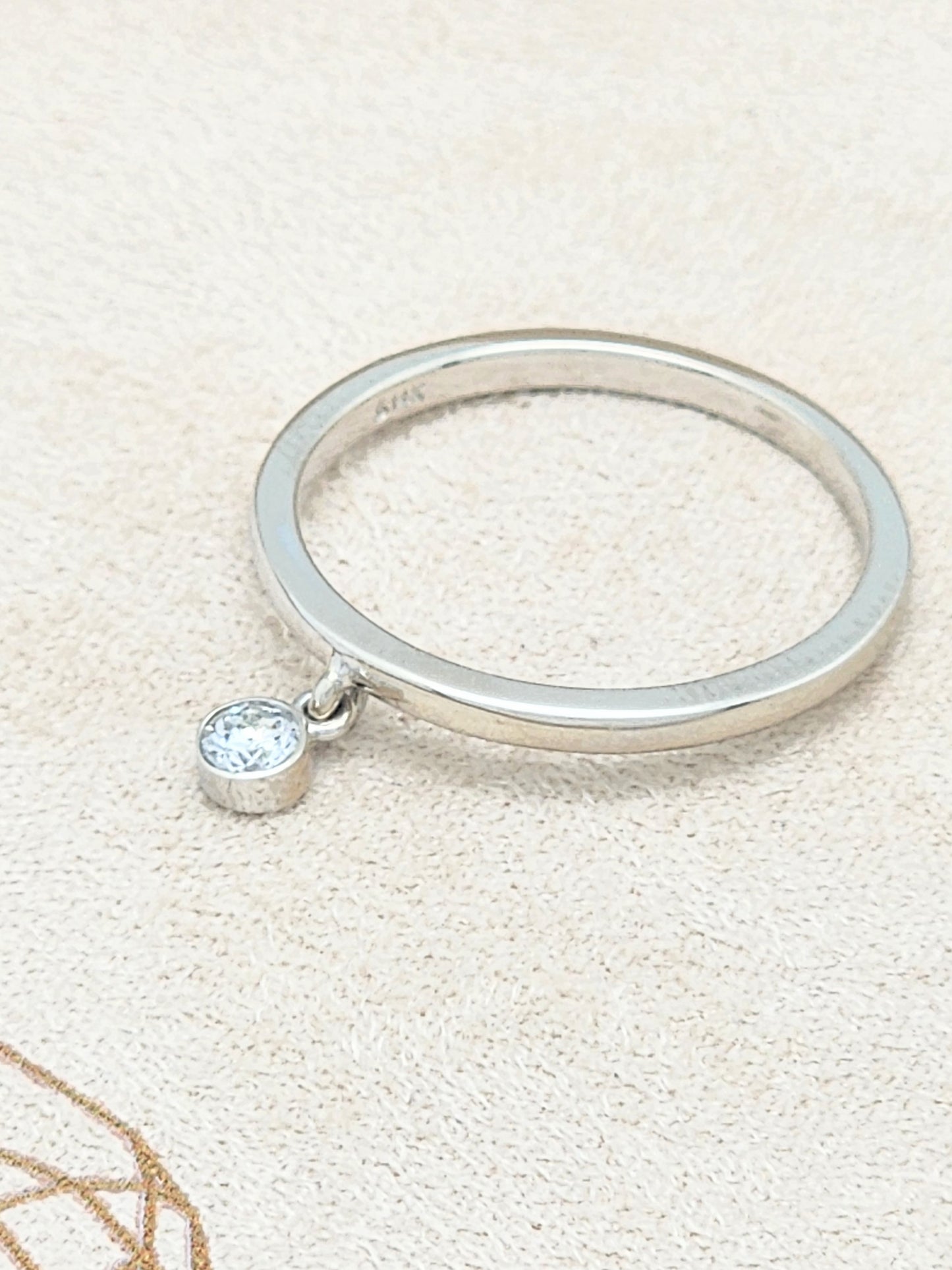 14KWG Band with Dangling .10 Carat Bezel-Set Diamond Size 7