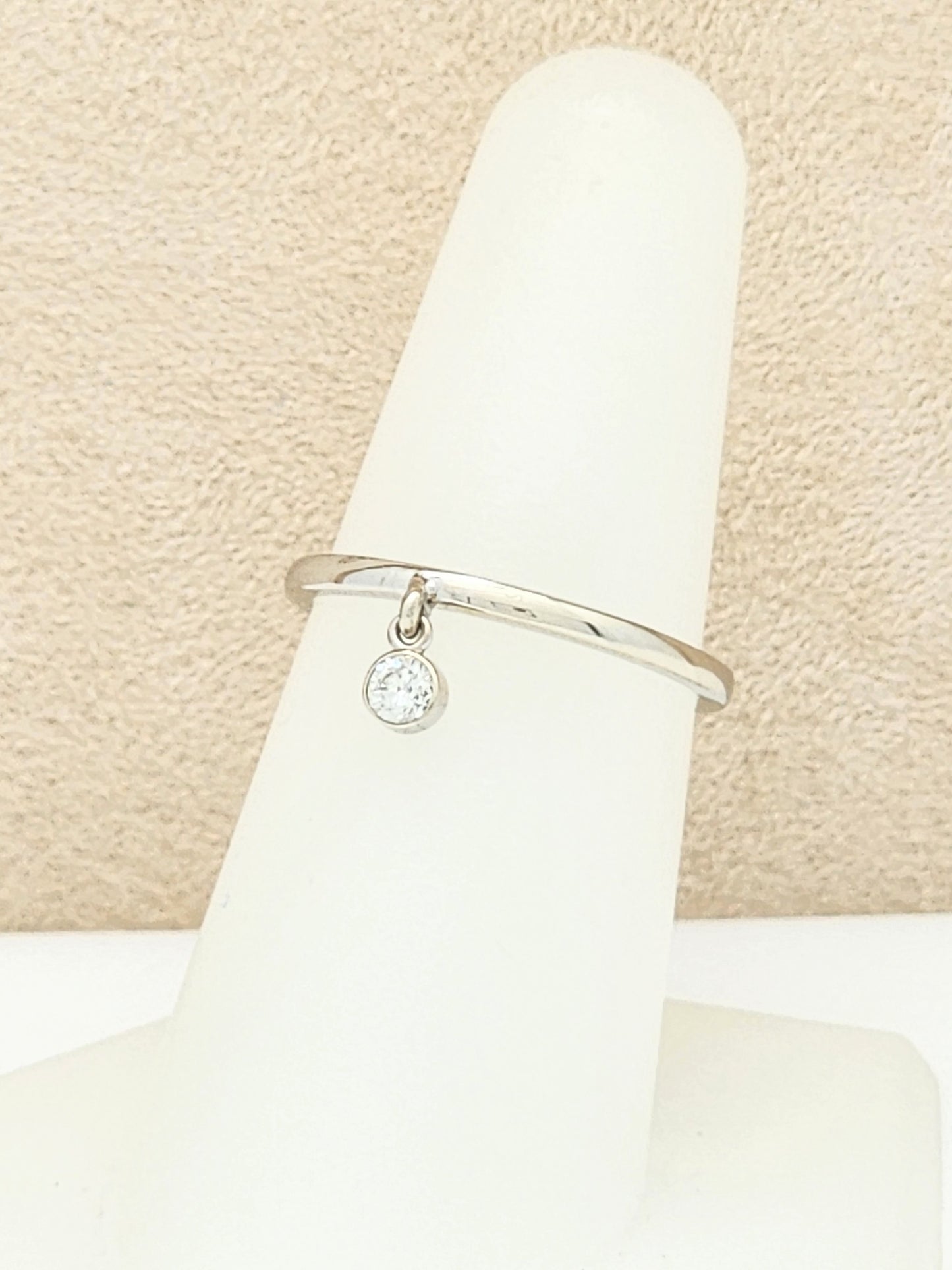 14KWG Band with Dangling .10 Carat Bezel-Set Diamond Size 7