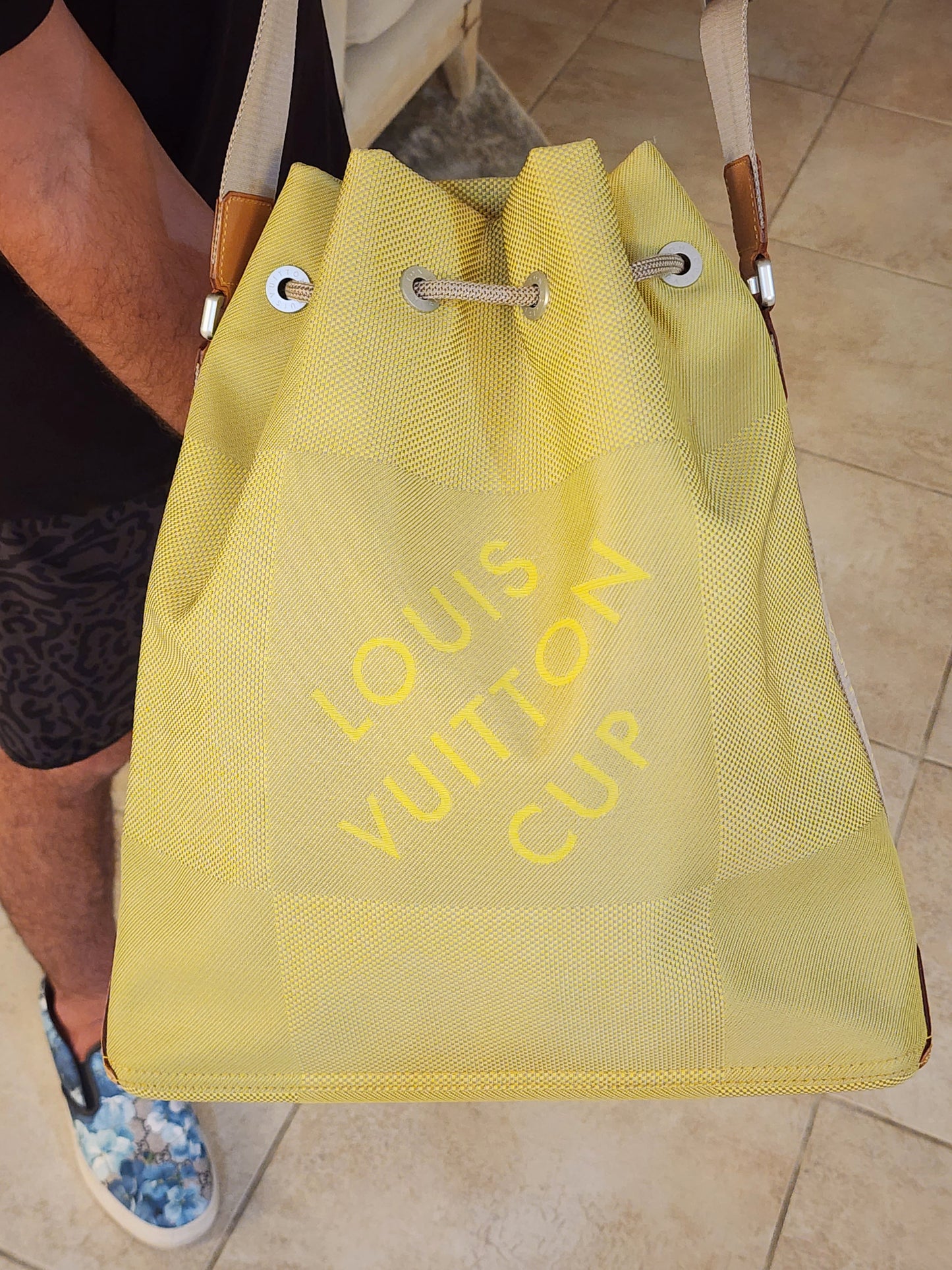 LOUIS VUITTON
Damier Geant Americas Cup Volunteer Bag in Yellow